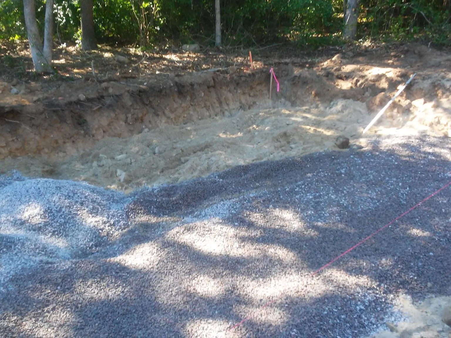 String lines set over a crushed stone leach field bed, septic system design